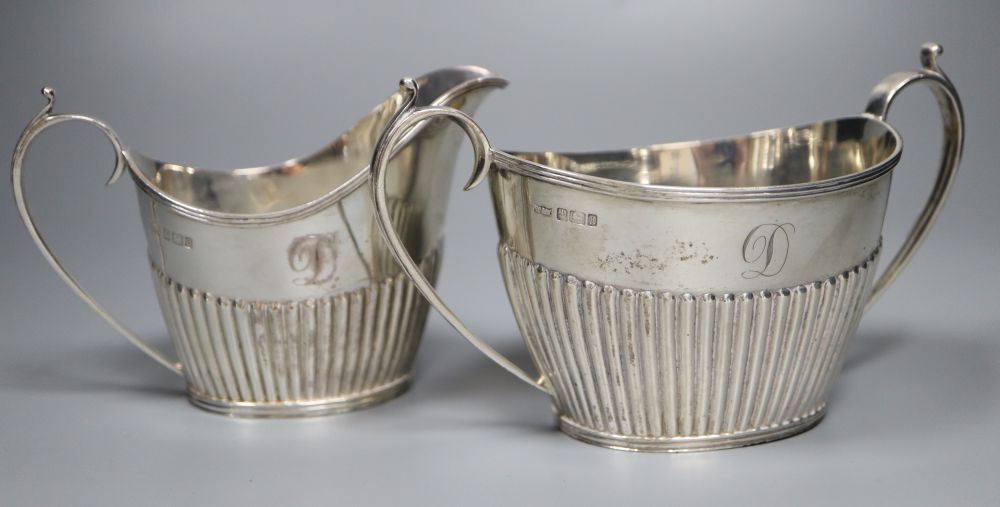 An Edwardian four piece demi-fluted oval silver tea and coffee set, Mappin & Webb, Sheffield, 1902, gross 38oz.